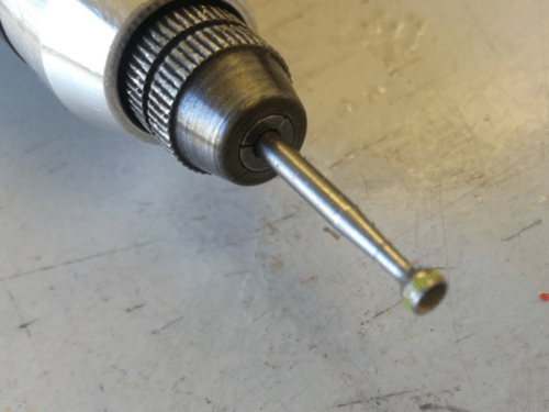 small drill mounted in the tool