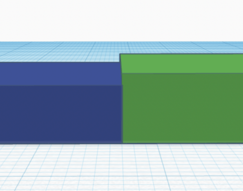 Two blocks against each other with the right one being slightly higher to create a tactile distinction.