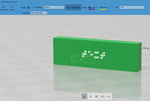 Braille dots in the form of cylinders are marked on the cuboid.