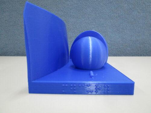 Side on view of solar system, Mercury in braille on the base